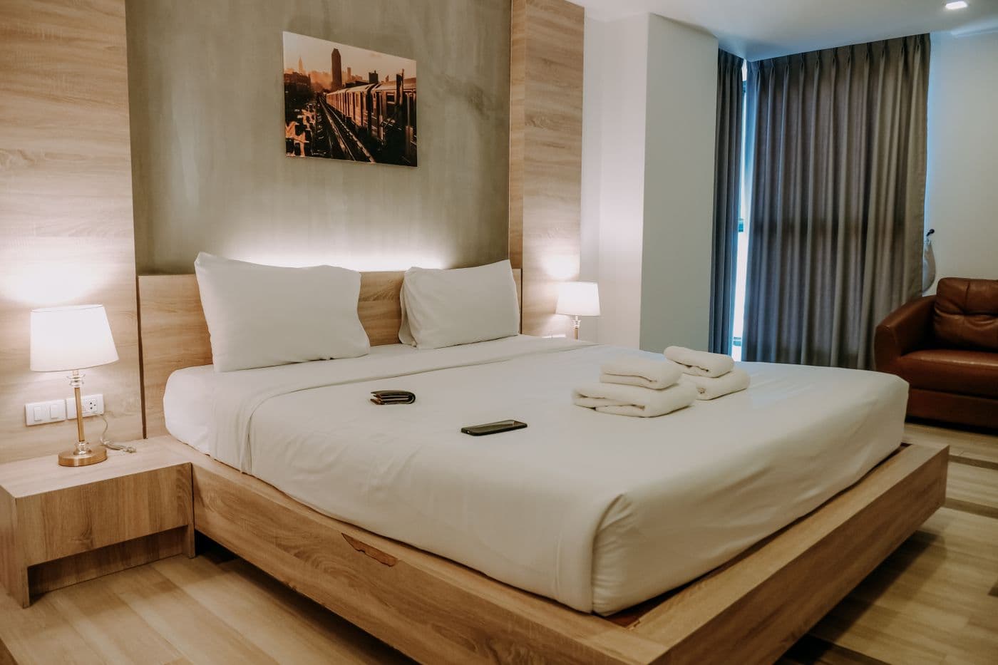 Warm modern guest room with soft bedside lighting